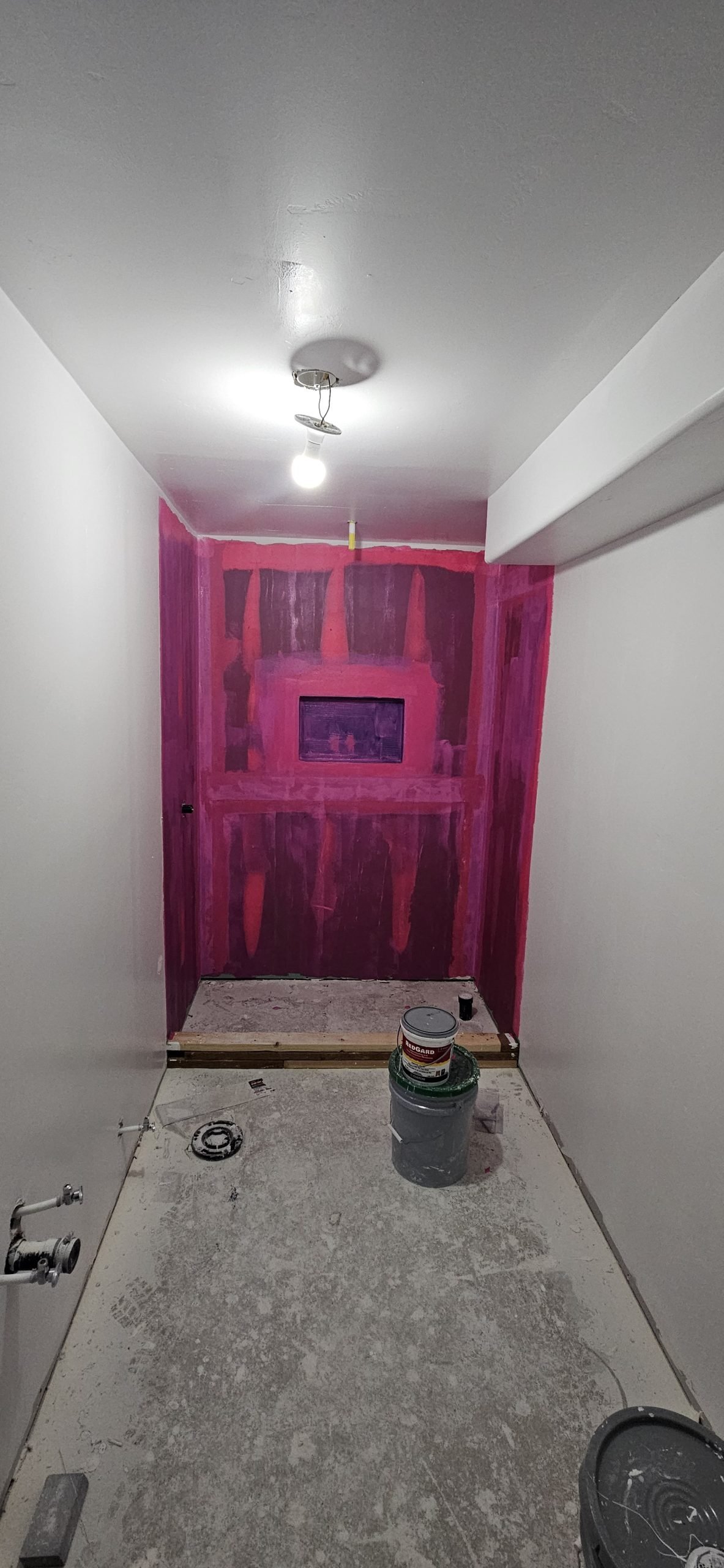 Bathroom remodeling project in Utah, showing walls and shower area under construction.