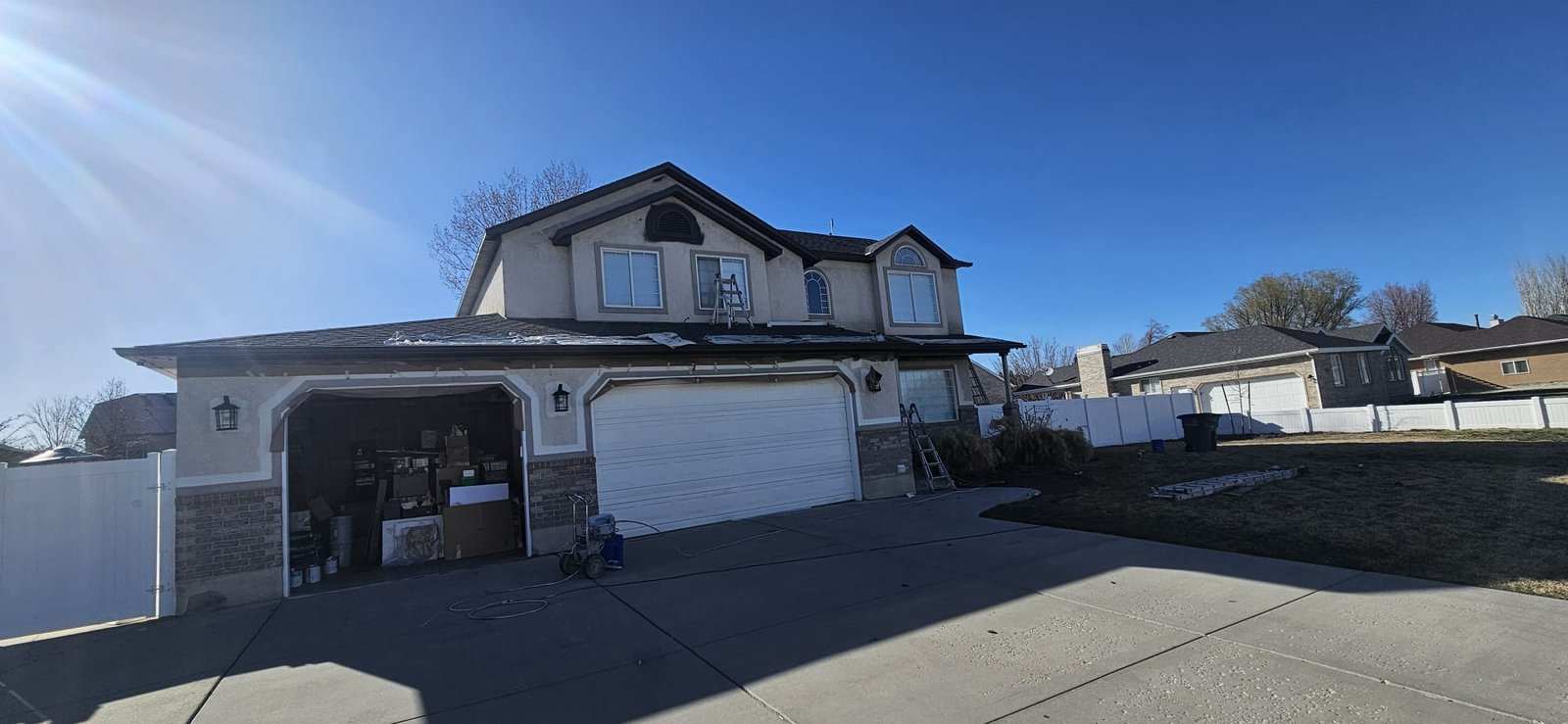 Gray House with White Trim and Garage in Utah ready to painting the home