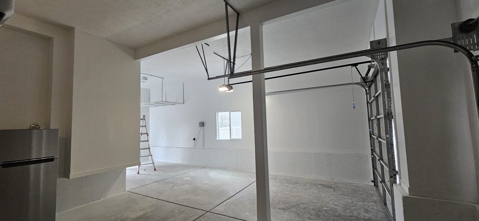 Recently Painted, Clean and bright garage with white walls and ceiling